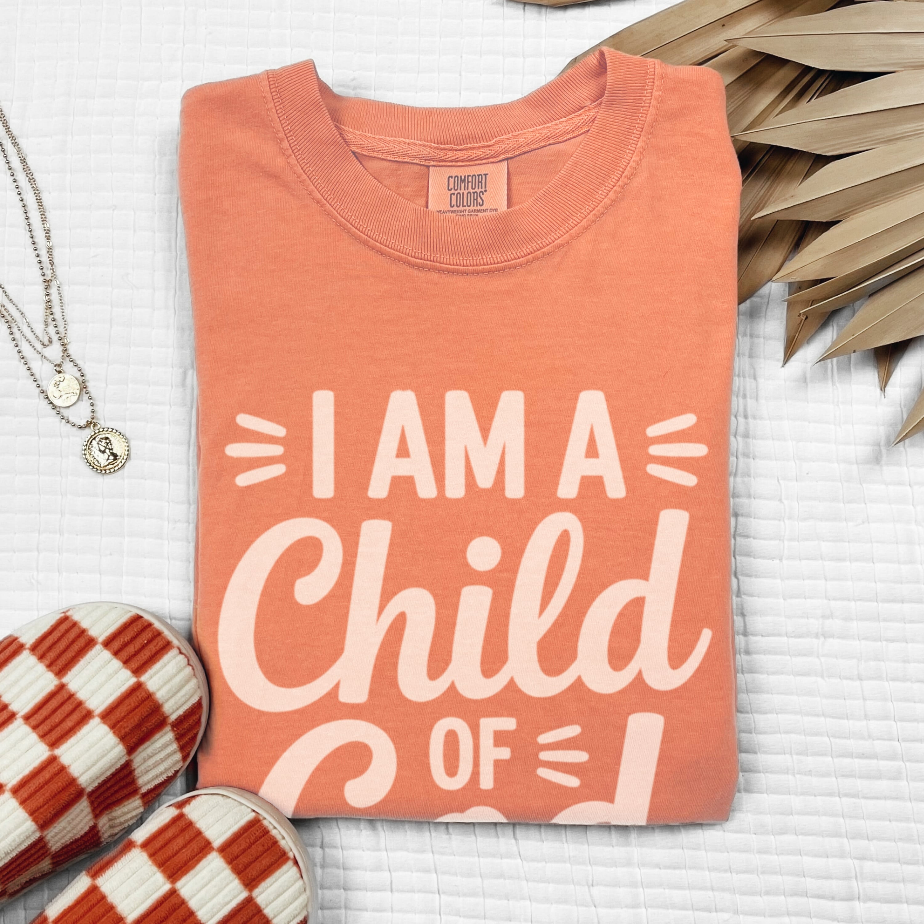 I Am A Child Of God scripture shirt in warm terracotta with soft cream text