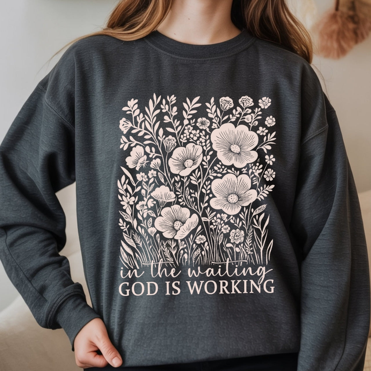 Woman wearing dark gray Christian sweatshirt with 