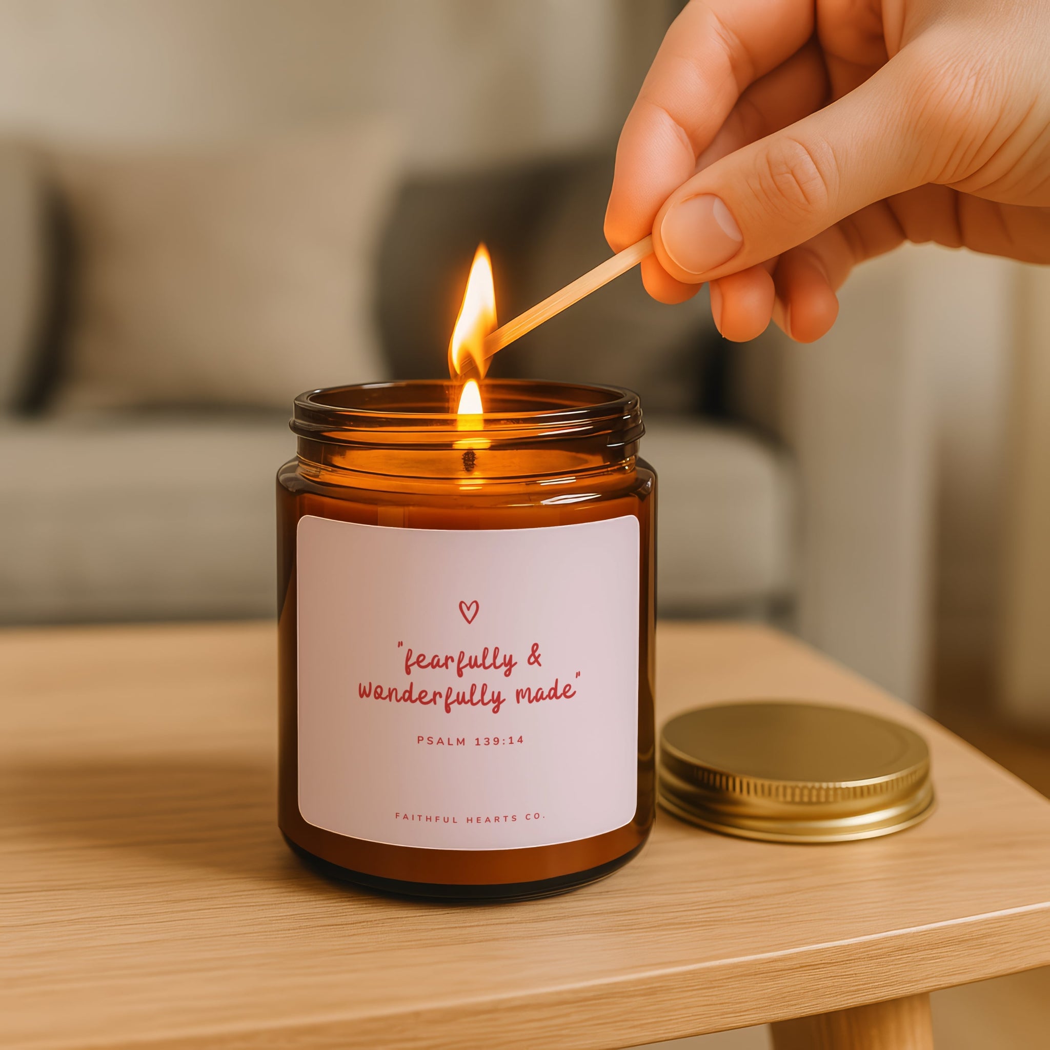 Fearfully and Wonderfully Made faith candle with soft pink label and red text, hand poured coconut apricot wax candle in amber jar