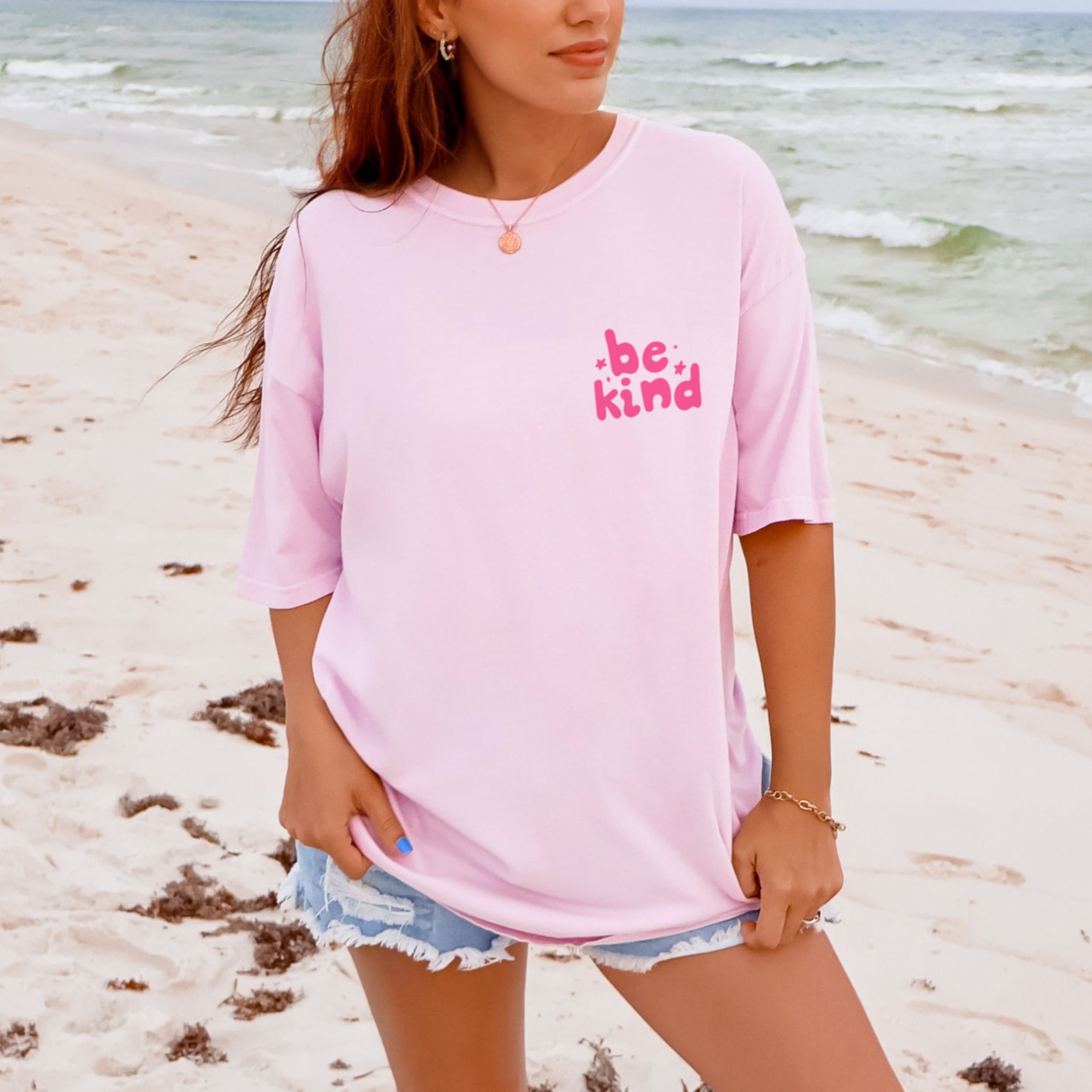 Soft pink Be Kind tshirt styled casually, inspirational graphic tee for women spreading kindness