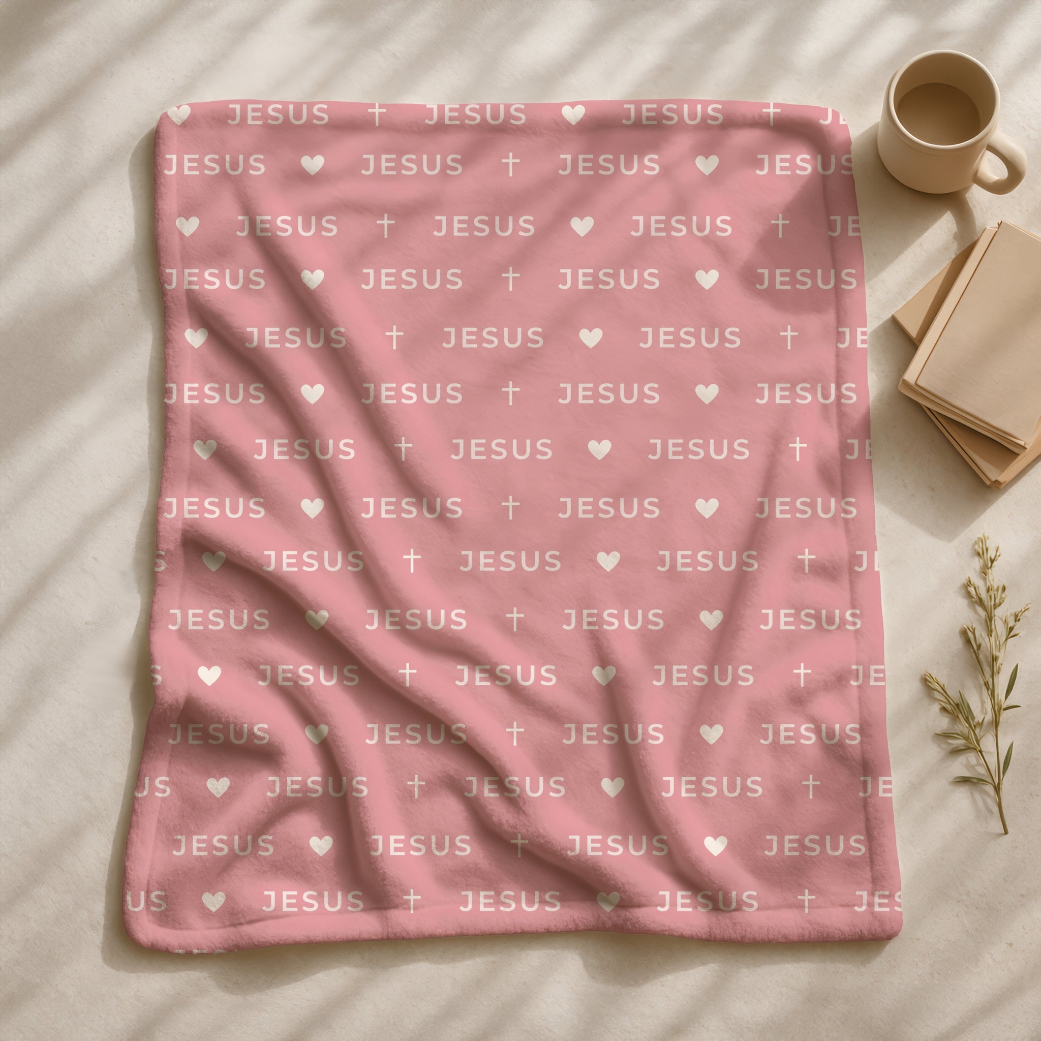Soft pink Christian throw blanket featuring repeated Jesus text