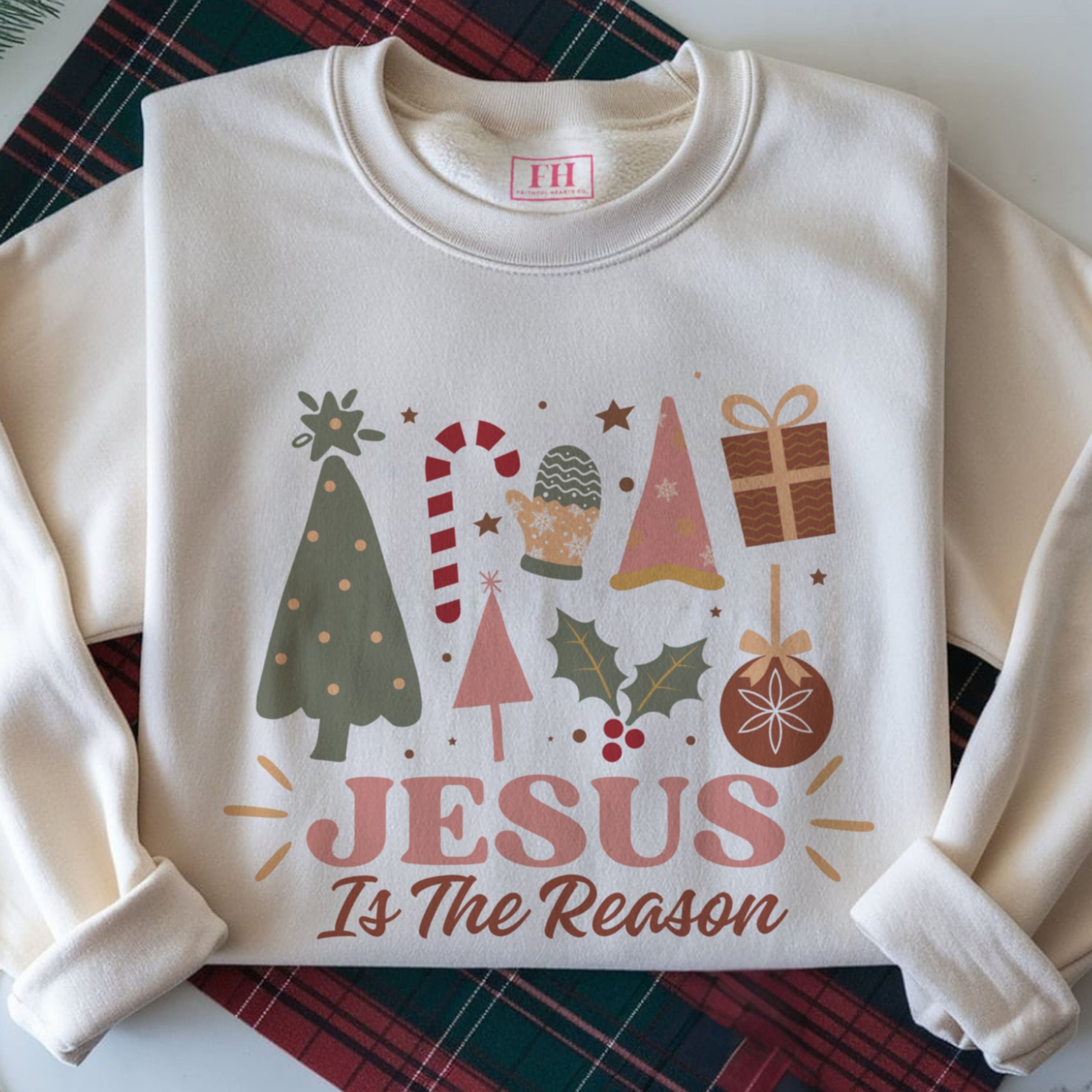 Jesus Is The Reason Christmas sweatshirt in sand, with cute girly design
