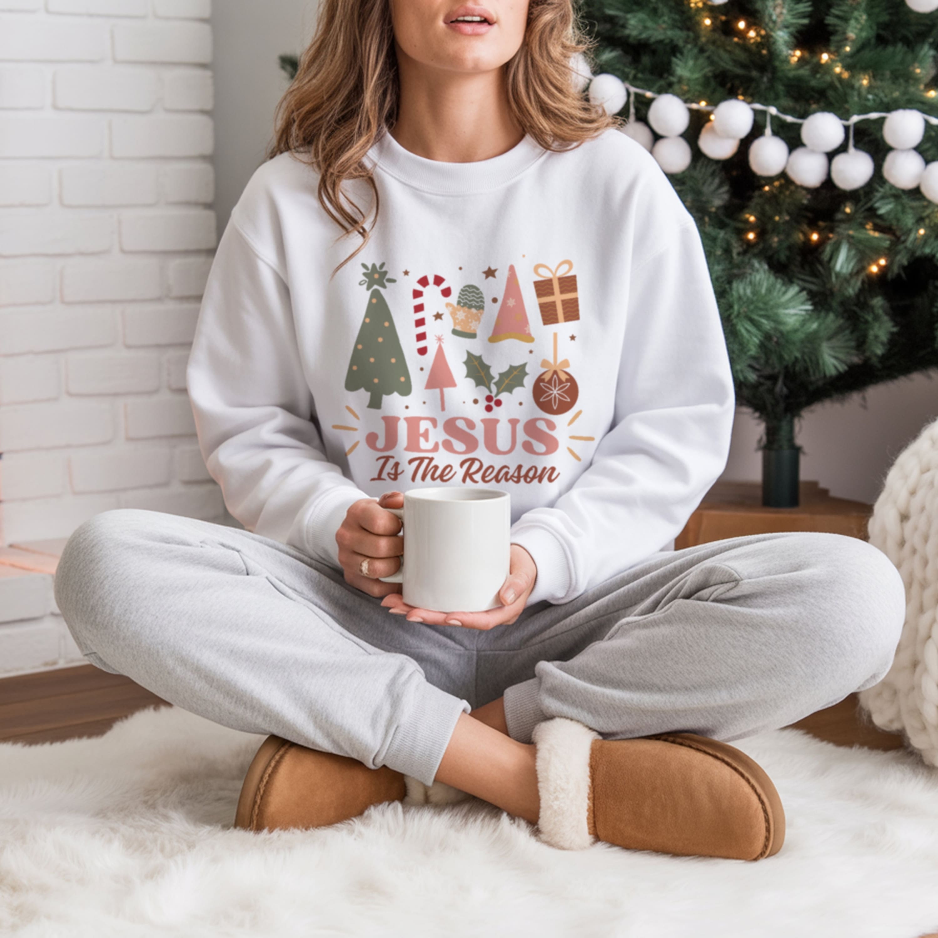 cute Jesus Is The Reason Christmas crewneck sweatshirt in white with festive graphics, women's Christian holiday sweater