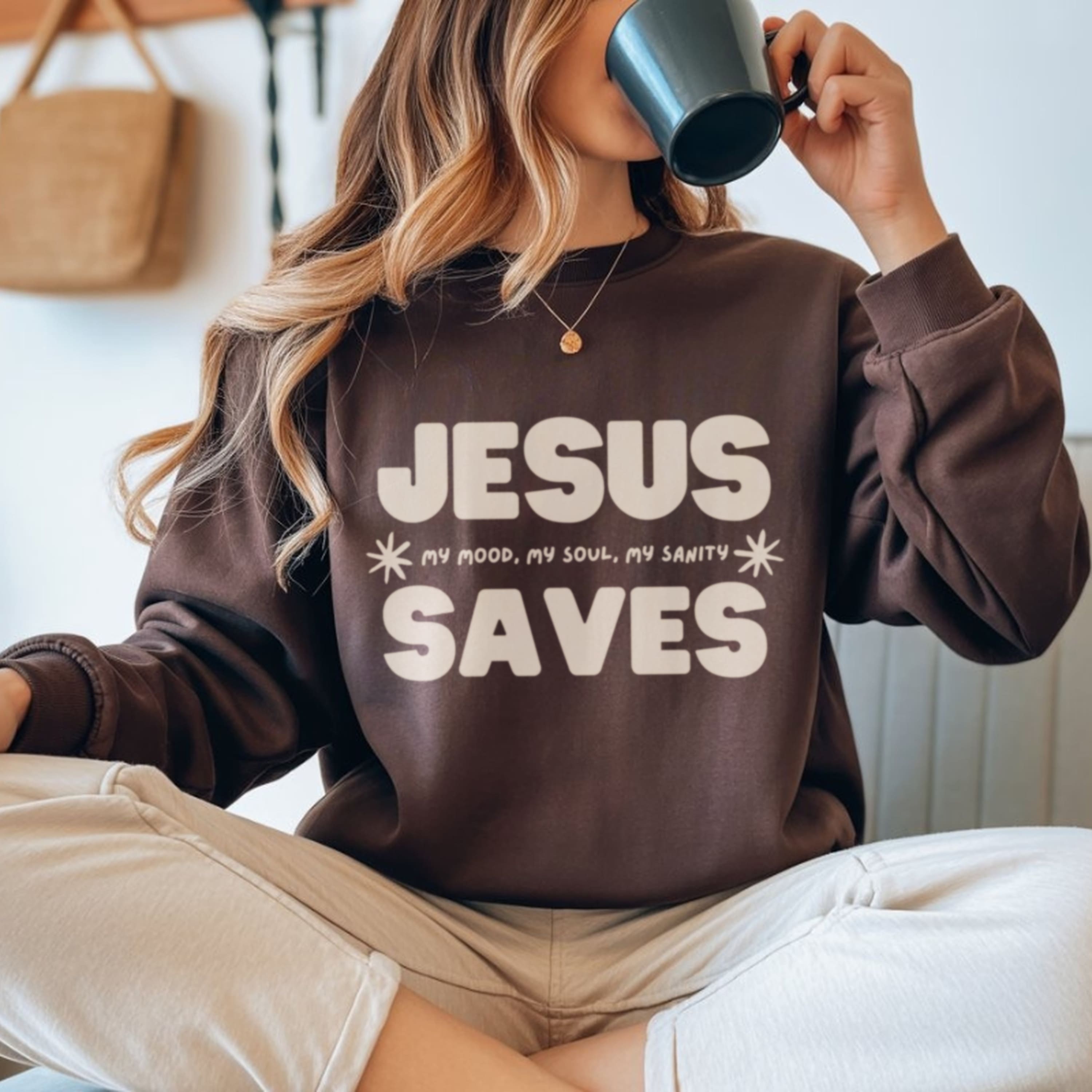 Jesus Saves crewneck sweatshirt in chocolate brown with cream lettering, women's Christian apparel