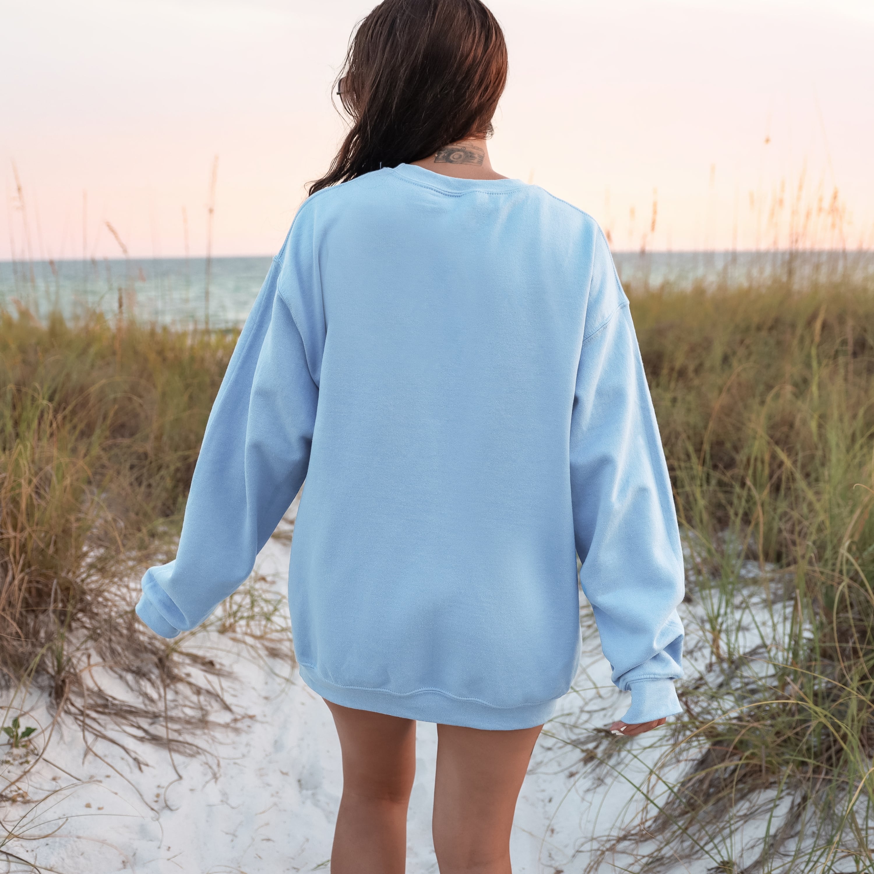 Back view of light blue Make Heaven Crowded sweatshirt - oversized Christian faith crewneck for women