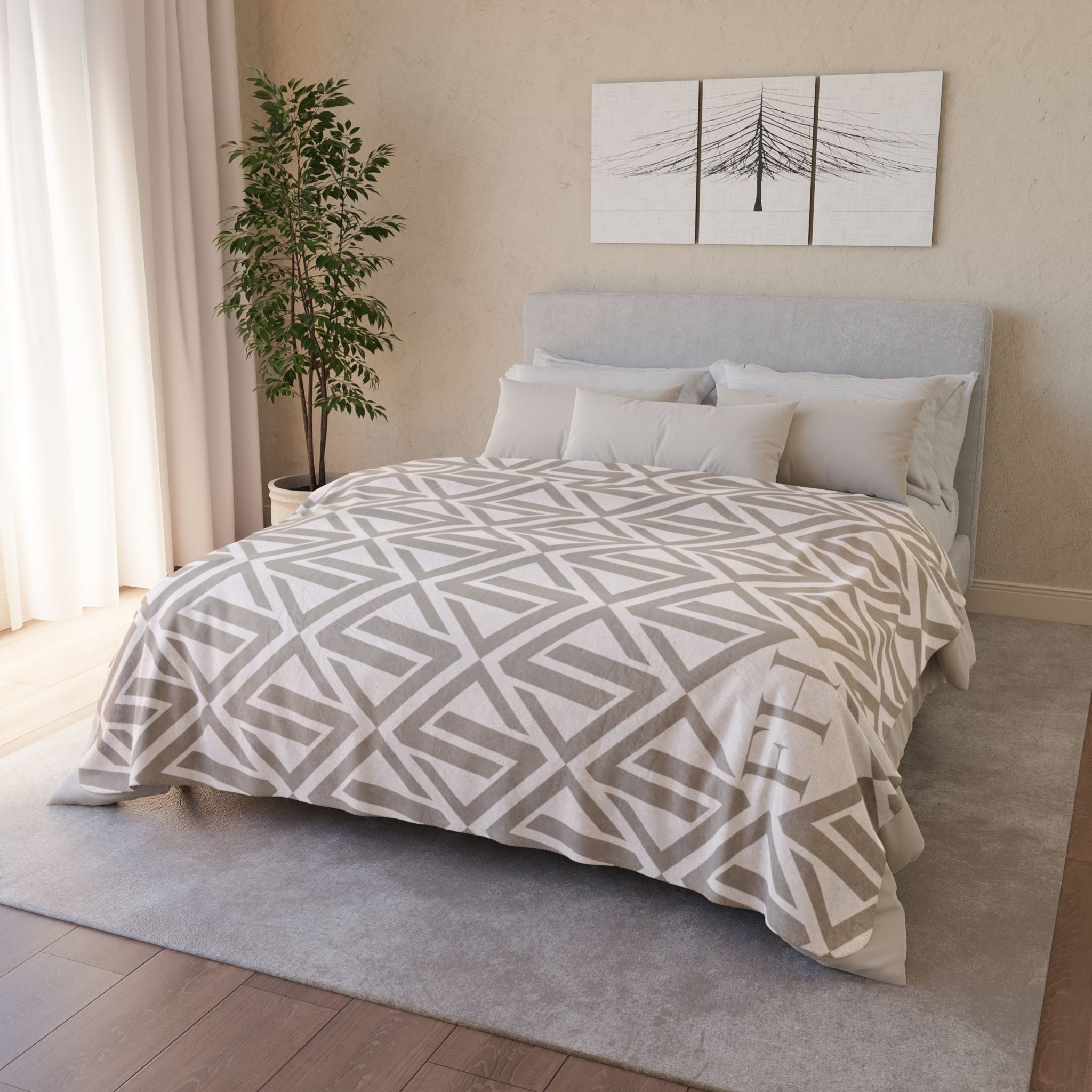 luxury sherpa blanket with a netural colored geometric pattern with the faithful hearts logo in the corner laying flat on a queen sized bed to show it fits fully. 