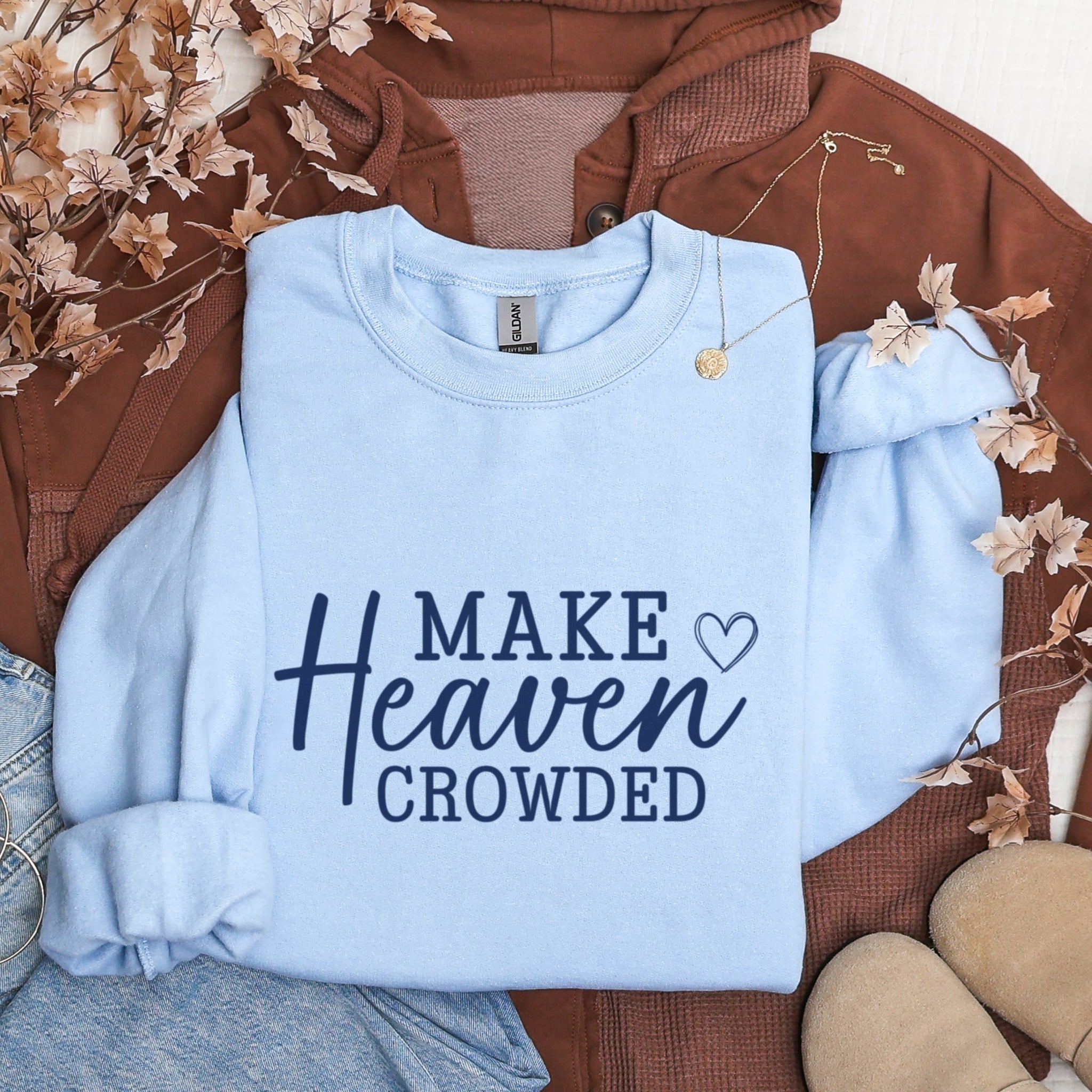 Make Heaven Crowded light blue sweatshirt flat lay - purpose-driven Christian mission apparel for women