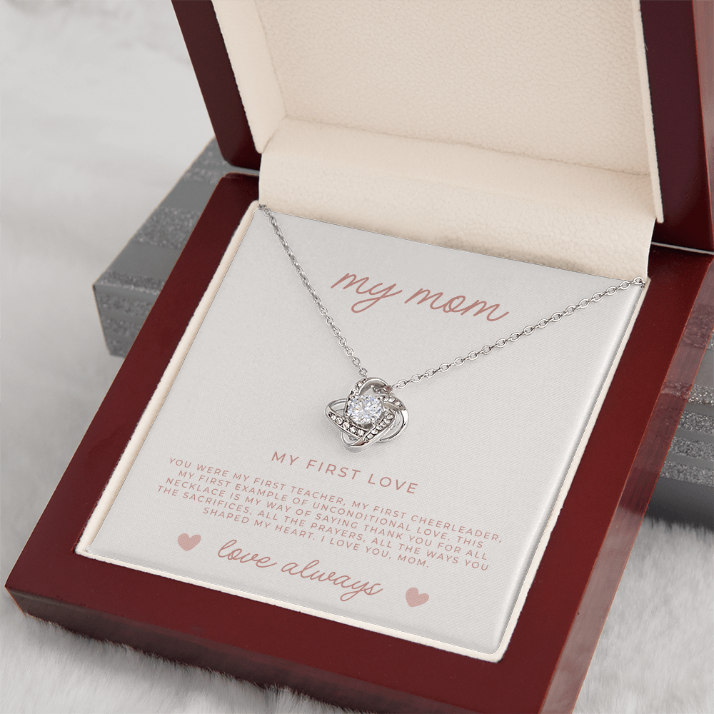 a white gold love knot necklace pendant with a message card for Christian moms
