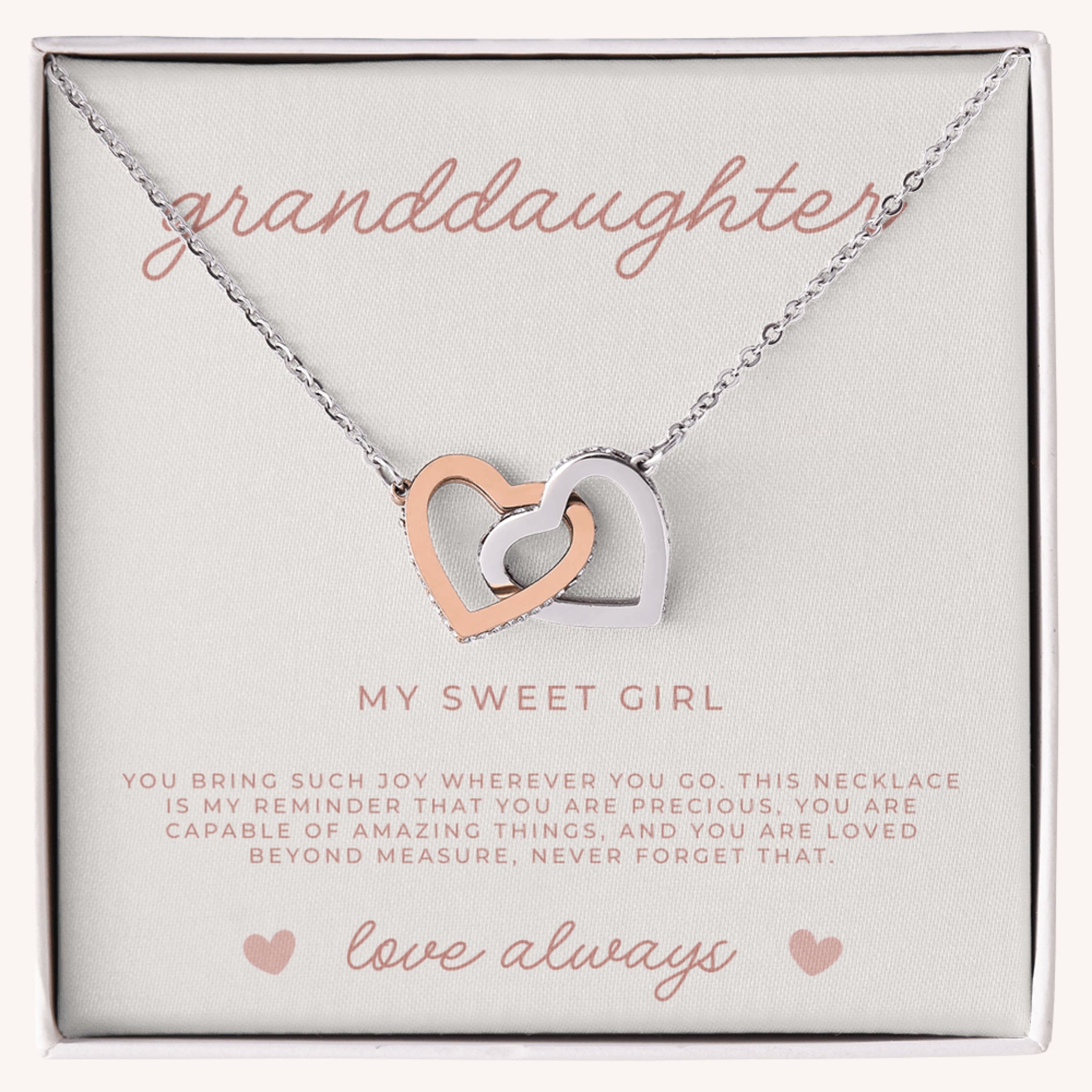 Necklace with interlocking heart pendants on a card labeled 'granddaughter' and 'my sweet girl'.