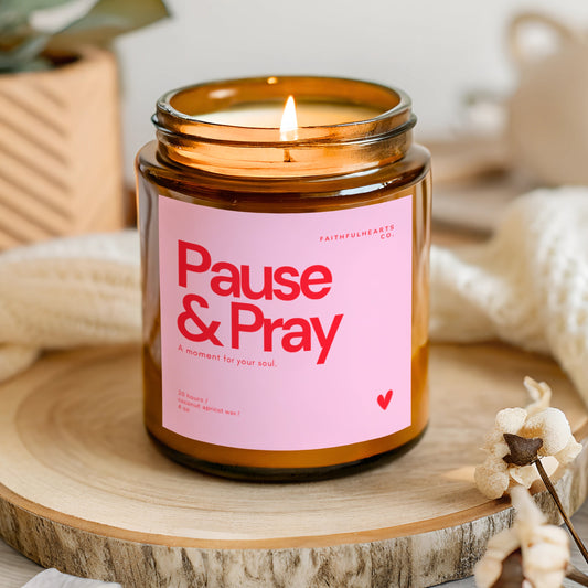 Pink label Pause & Pray candle, uplifting Christian candle for mindfulness and prayer time.