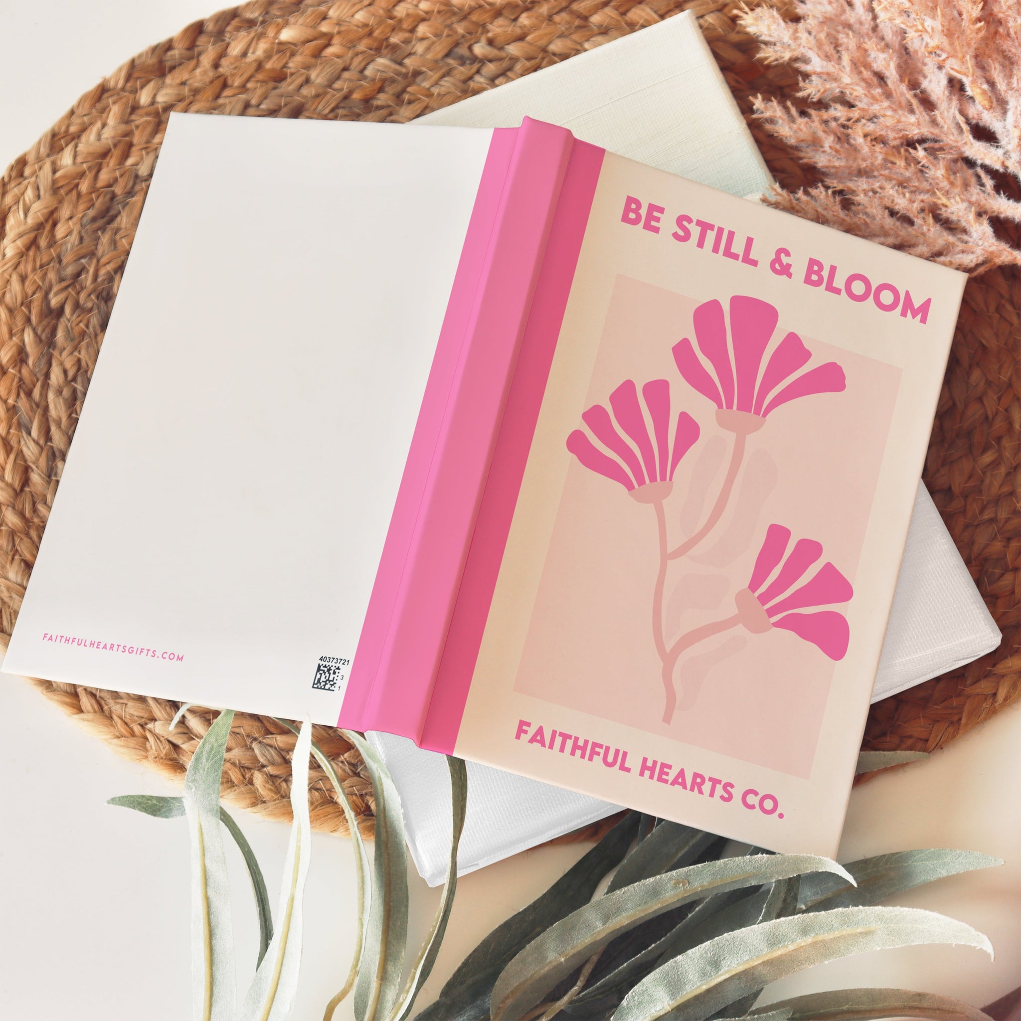 Soft cream and pink faith-based hardback journal with flower design and “Be Still & Bloom” cover