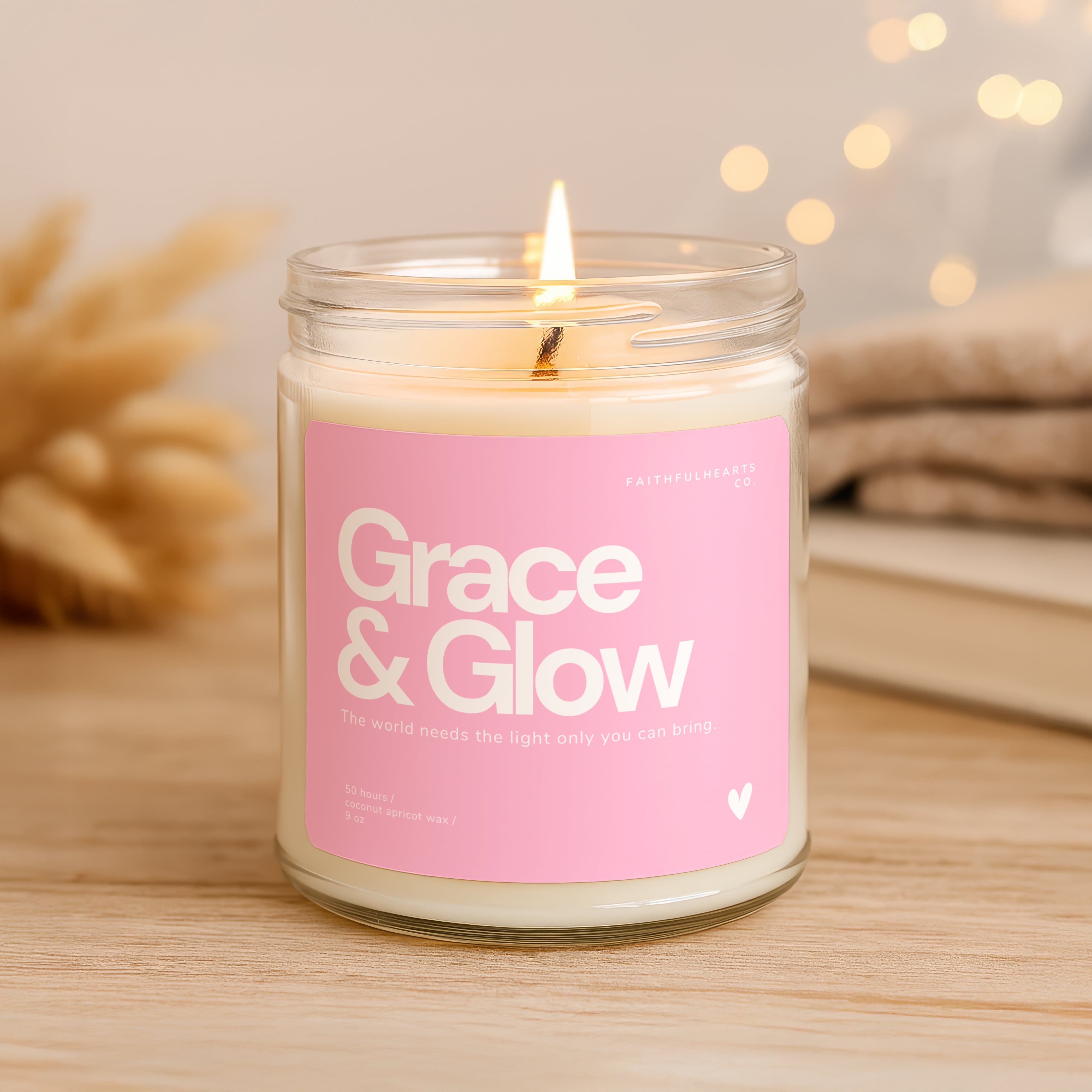 Grace & Glow faith candle in clear glass jar with pink label, inspirational candle for women with quote “The world needs the light only you can bring,” perfect wellness or self care gift.