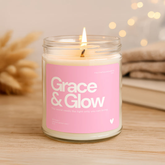 Grace & Glow faith candle in clear glass jar with pink label, inspirational candle for women with quote “The world needs the light only you can bring,” perfect wellness or self care gift.