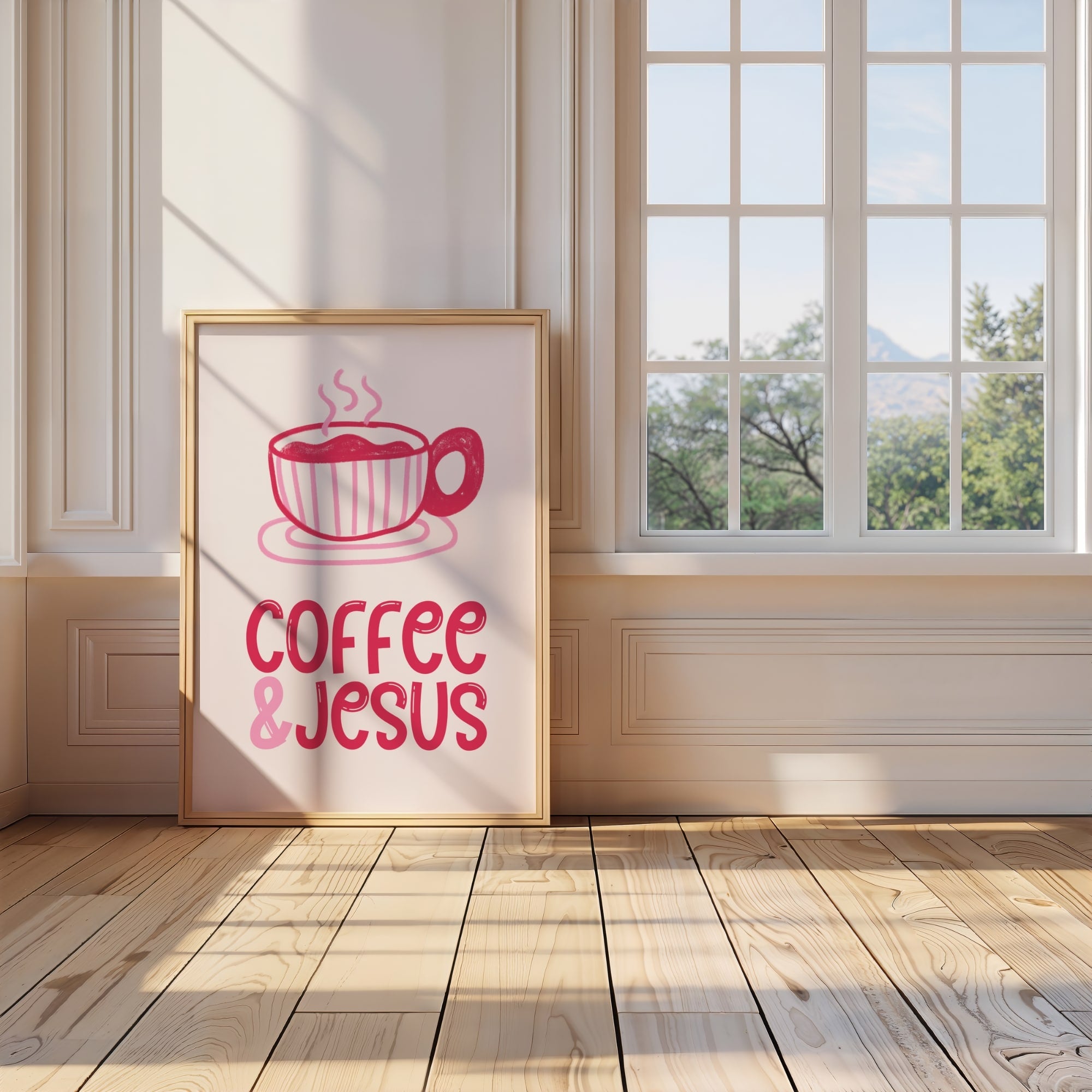 Framed poster with 'Coffee & Jesus' design in a room with a window and wooden floor.