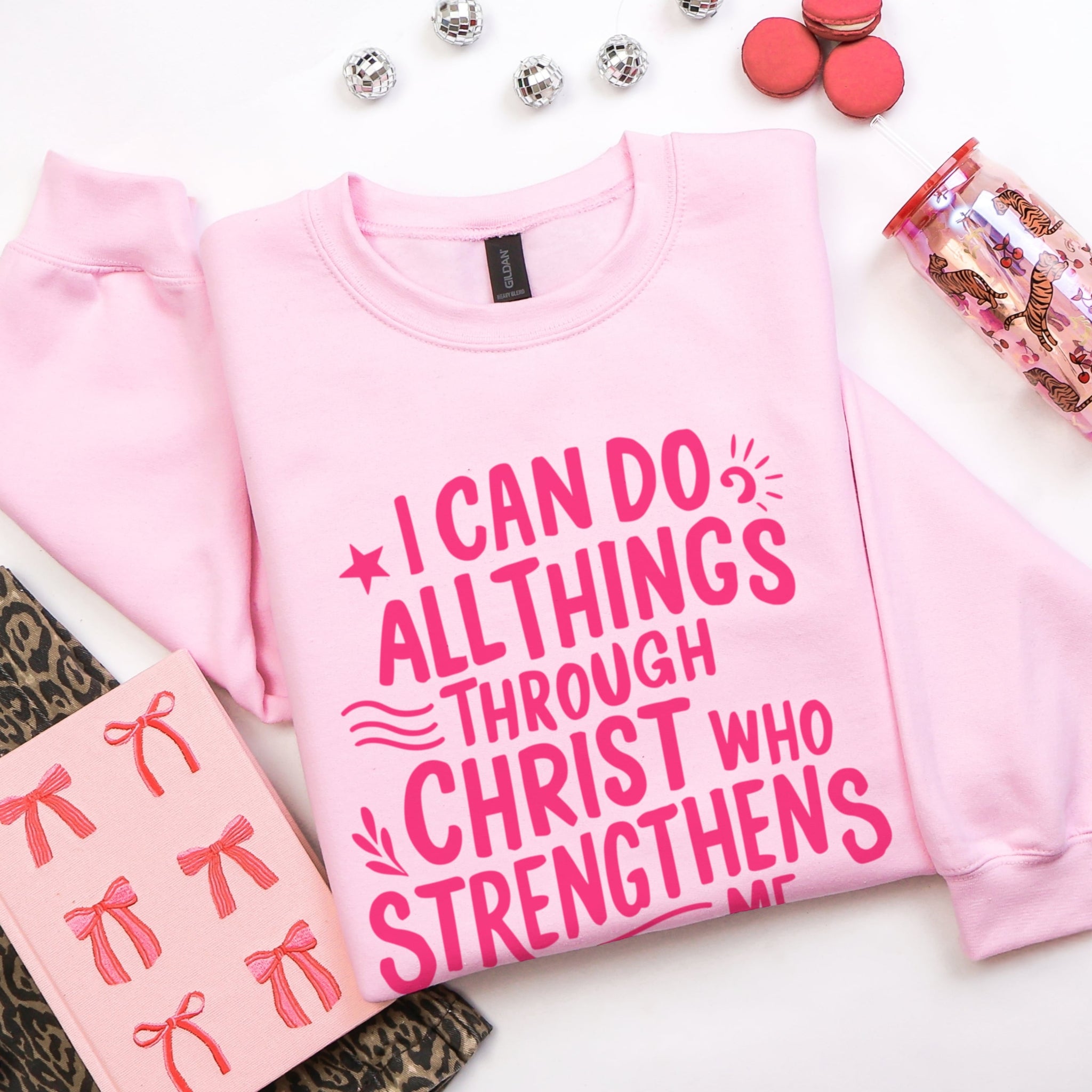 Pink Philippians 4:13 sweatshirt flat lay with girly accessories - I Can Do All Things Through Christ faith-based apparel for women