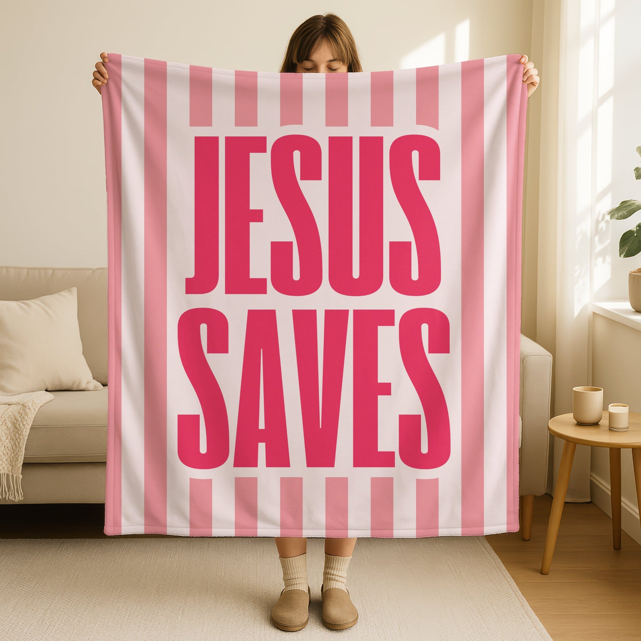 Modern faith-based blanket with Jesus Saves lettering in pink and white stripes
