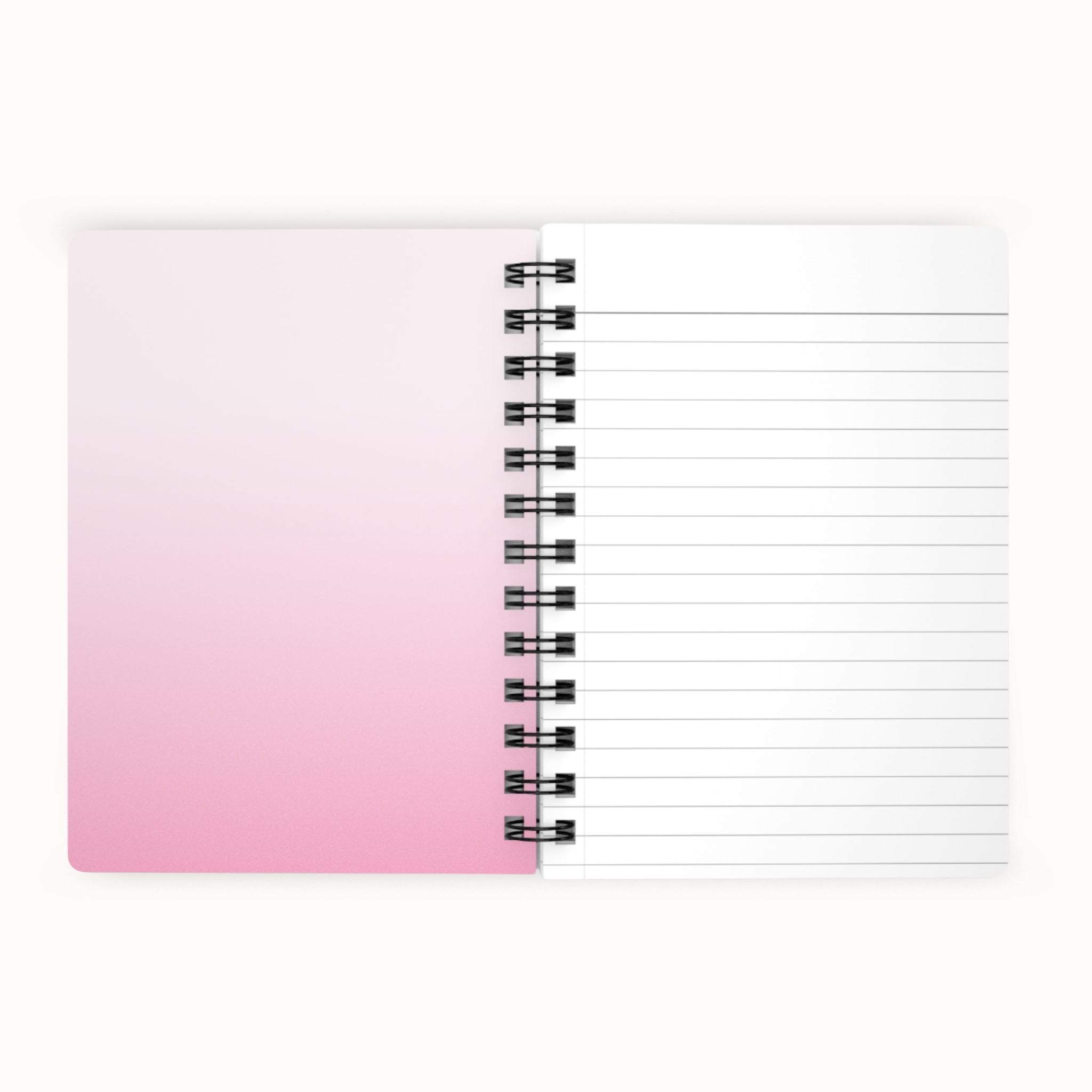 Notebook with pink to white gradient cover on a white background