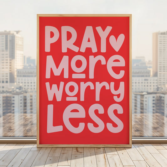 Pray More Worry Less Christian wall art print with vibrant red background and soft pink bold typography featuring a small heart accent, modern faith-based home decor