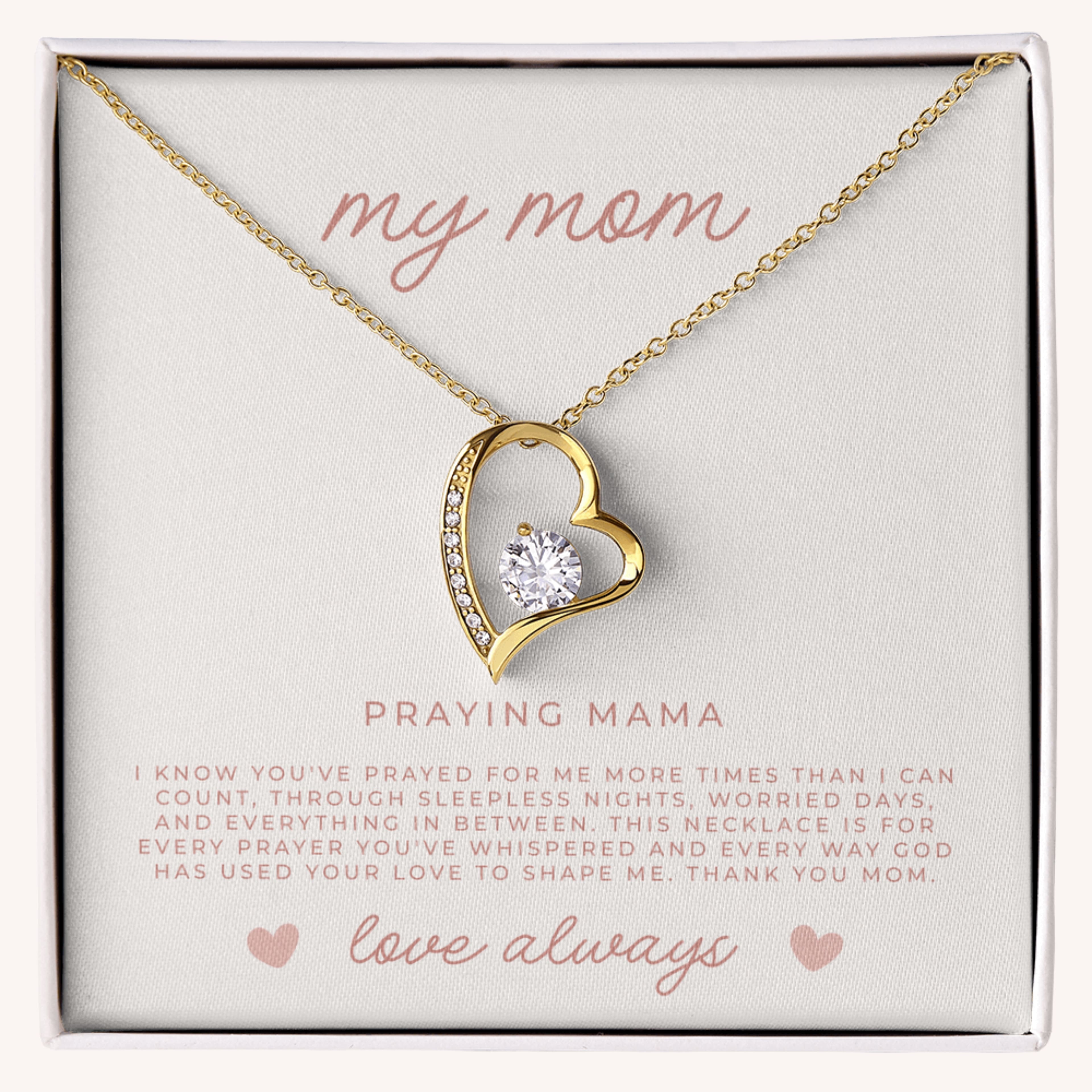 Gold heart-shaped necklace with a diamond with a card that reads 'my mom' and 'Praying Mama', for christian moms