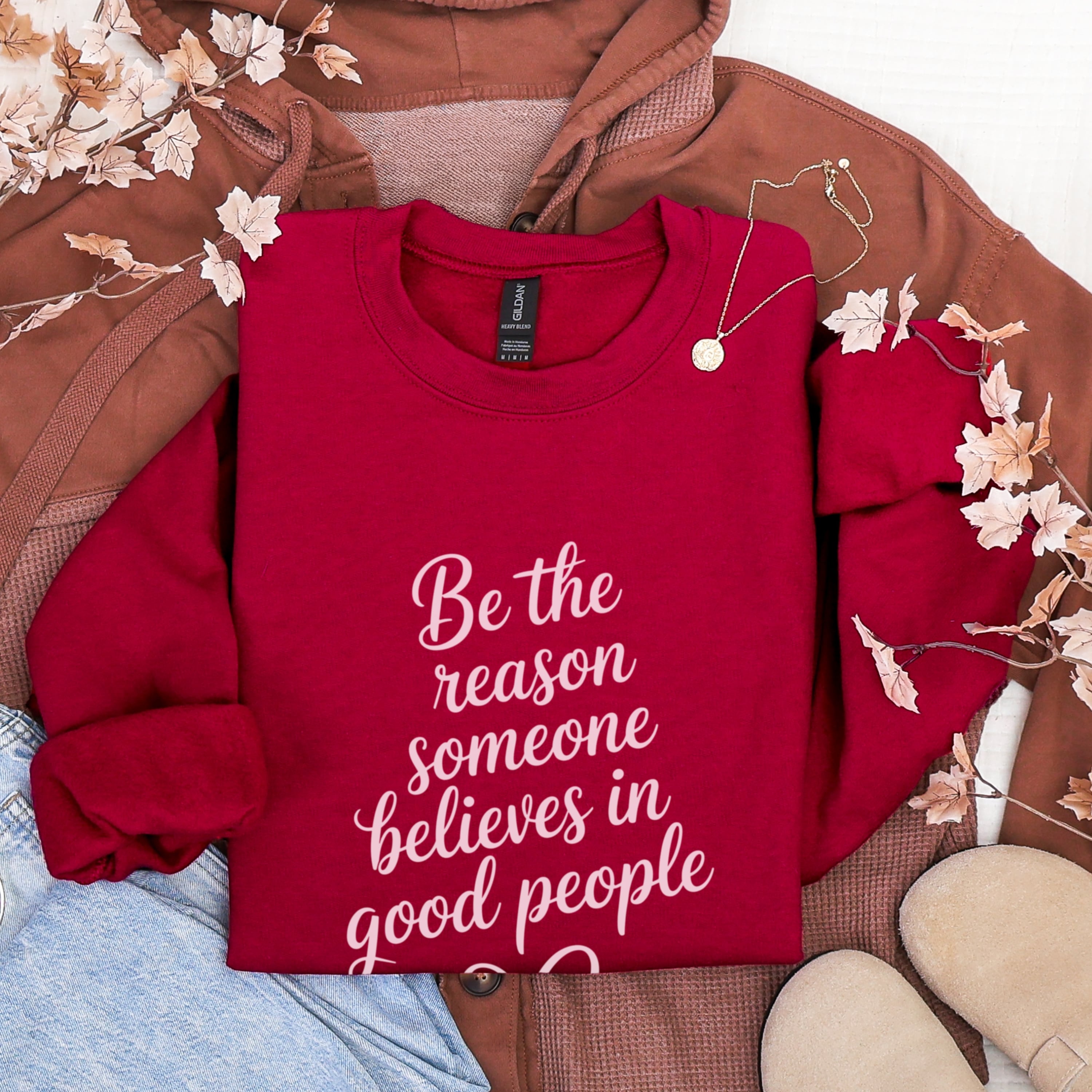 red Be The Reason Good People sweatshirt with pink lettering flat lay - positive message inspirational apparel for women