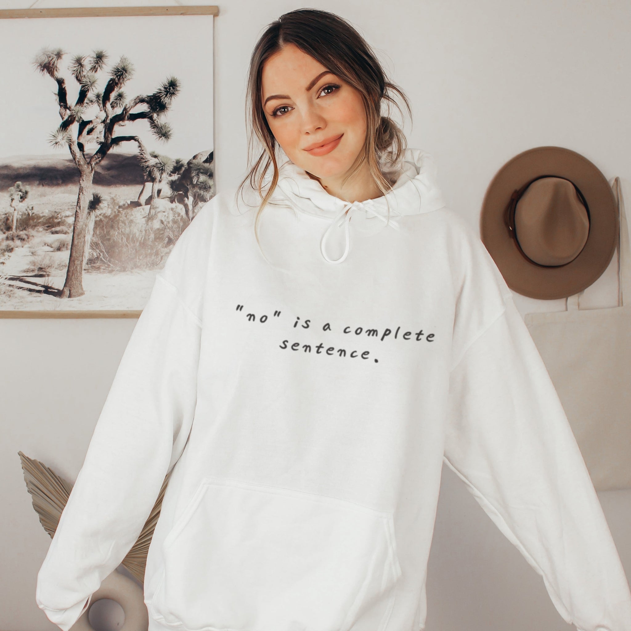 Woman wearing white no is a complete sentence hoodie, soft life boundary setting sweatshirt for women