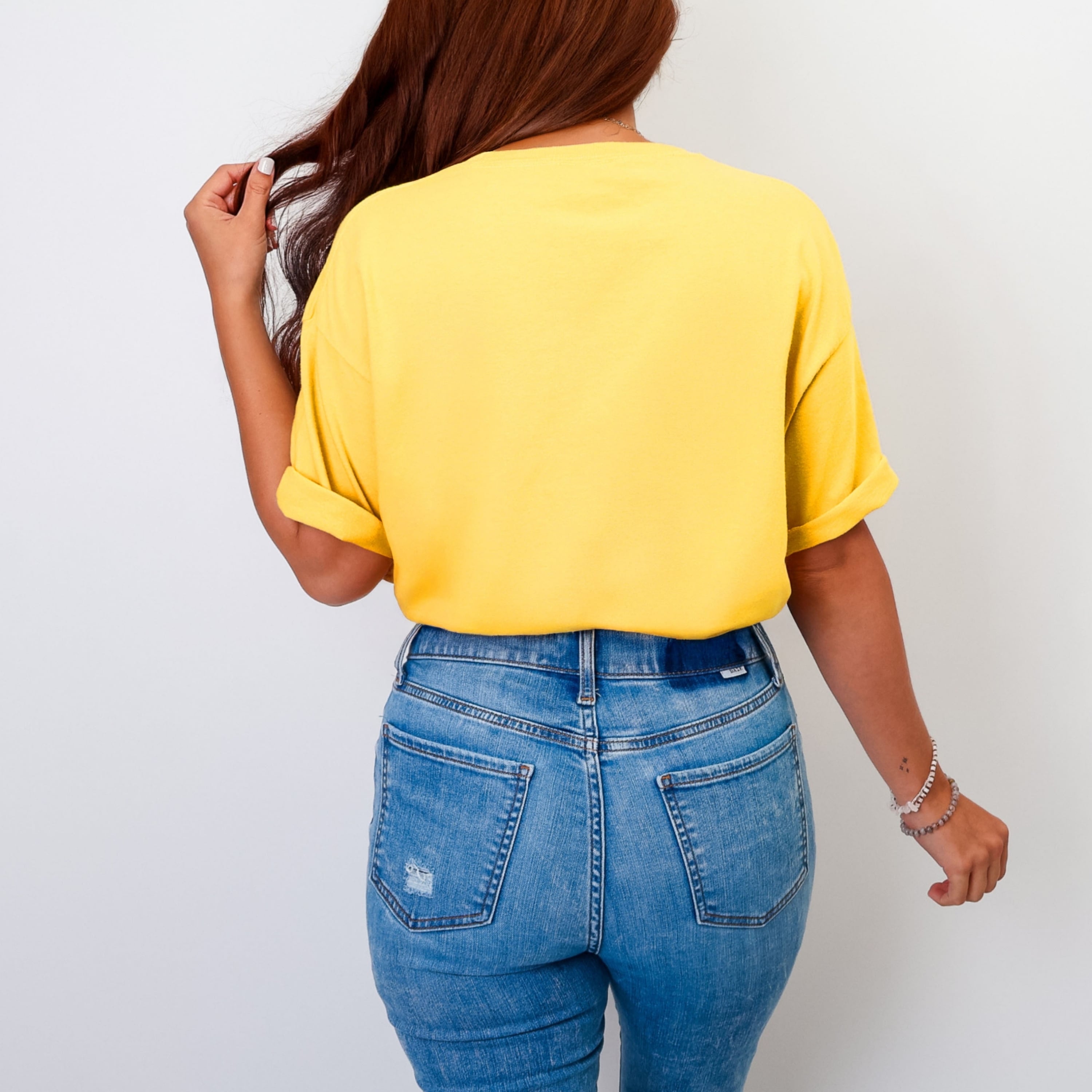 Oversized fit Ephesians 2:8 tshirt in citrus yellow styled with jeans, trendy faith-based graphic tee for women