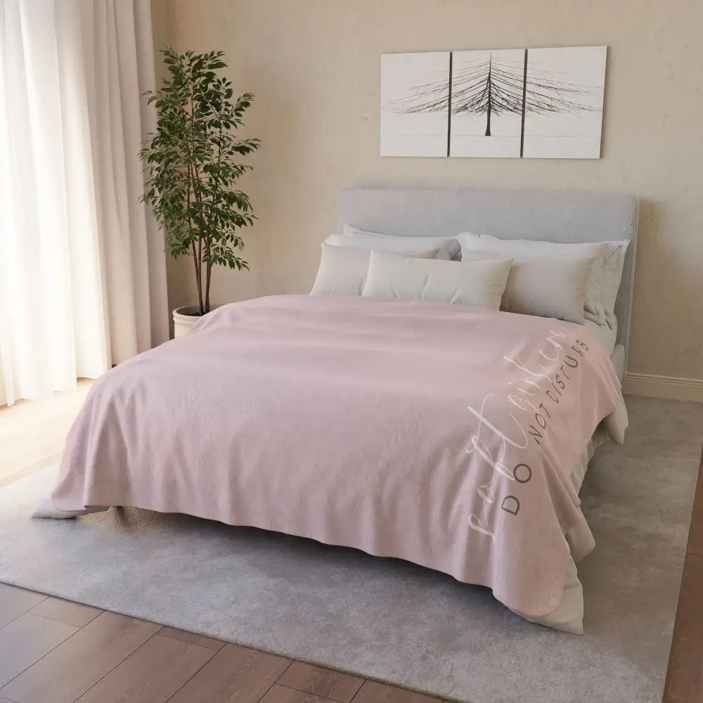 minimalist style pink extra large sherpa fleece blanket with feminine soft girl era written, laying on a bed