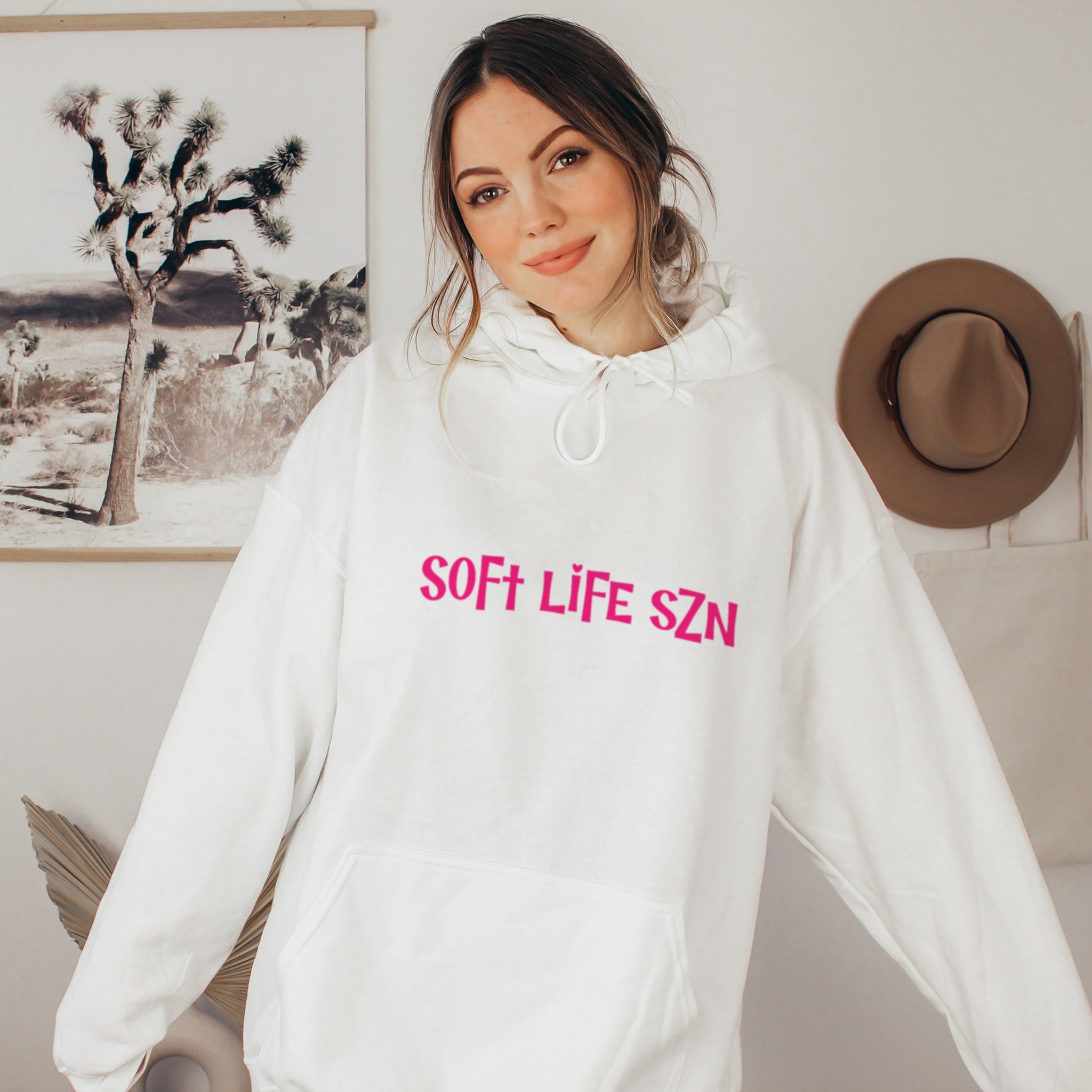 
Woman in white soft life SZN hoodie, cozy soft girl era sweatshirt