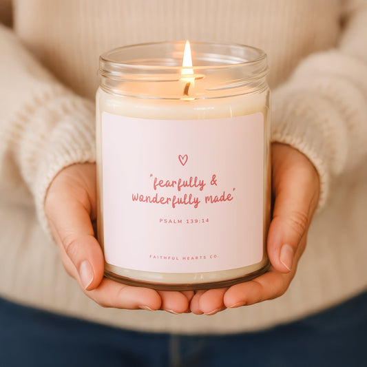 Fearfully and Wonderfully Made faith candle in clear glass jar with soft pink label and red text, hand poured coconut soy wax, made in USA.