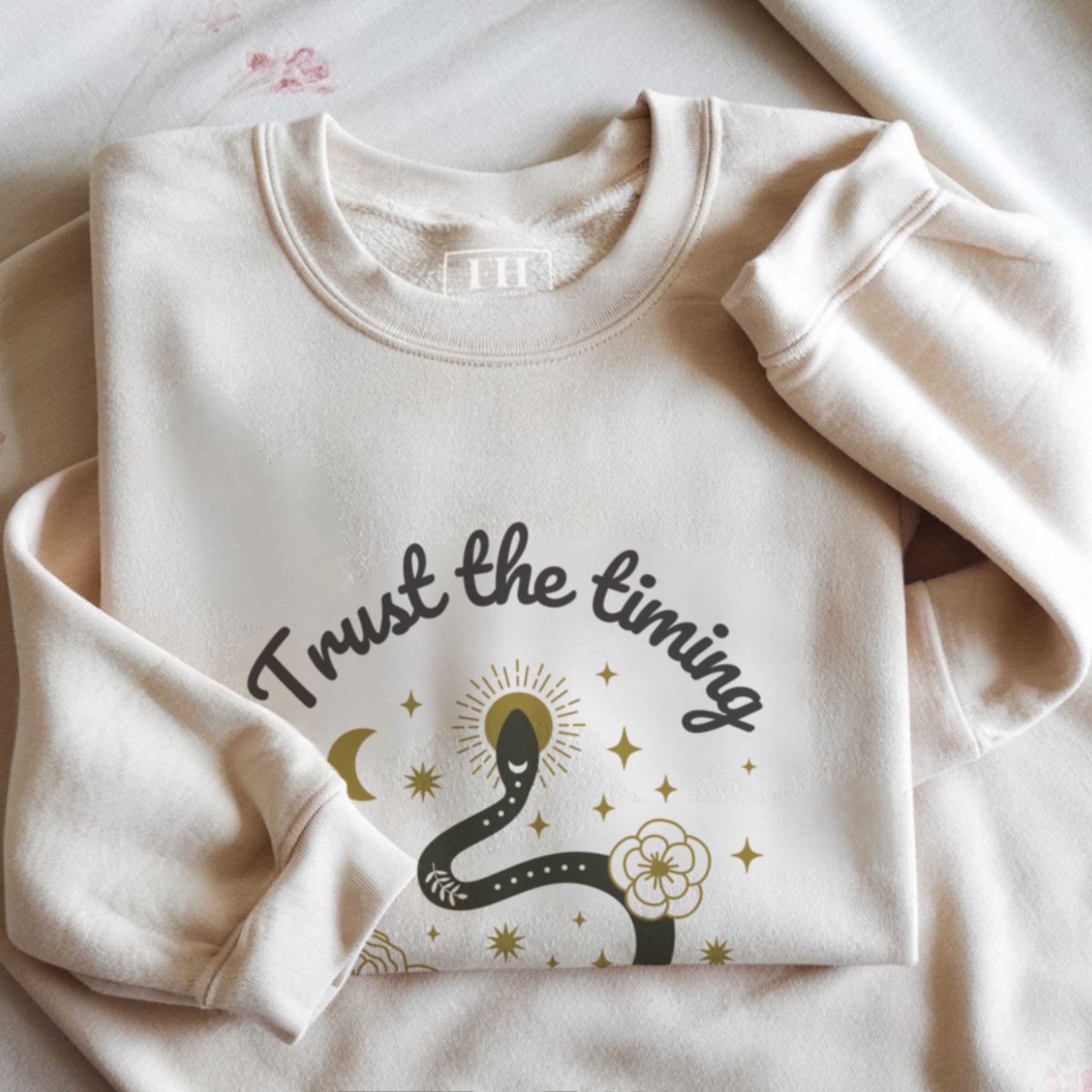 Trust the timing trust the journey spiritual sweatshirt flat lay with mystical boho snake design by Faithful Hearts Co