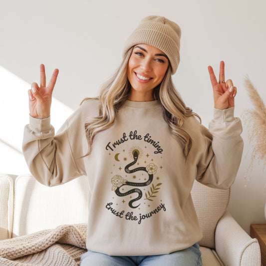 Trust the timing trust the journey sweatshirt in sand with mystical snake and moon design, boho spiritual faith crewneck for women