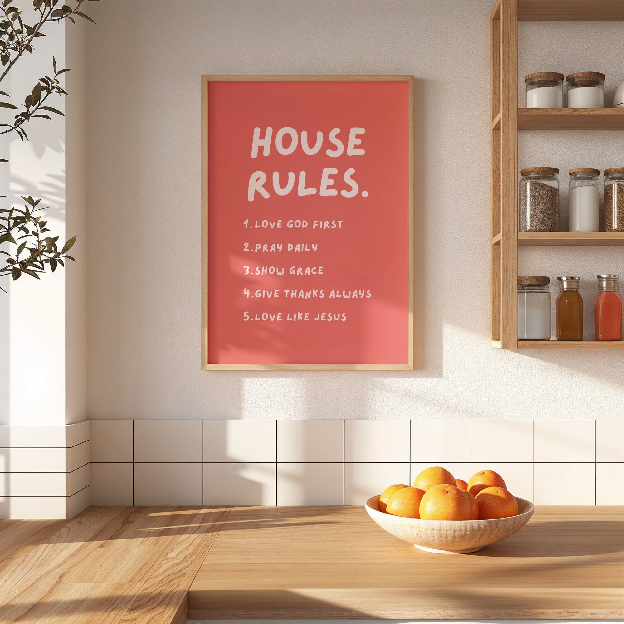 Christian House rules poster on a wall in a kitchen with a bowl of oranges on a counter.