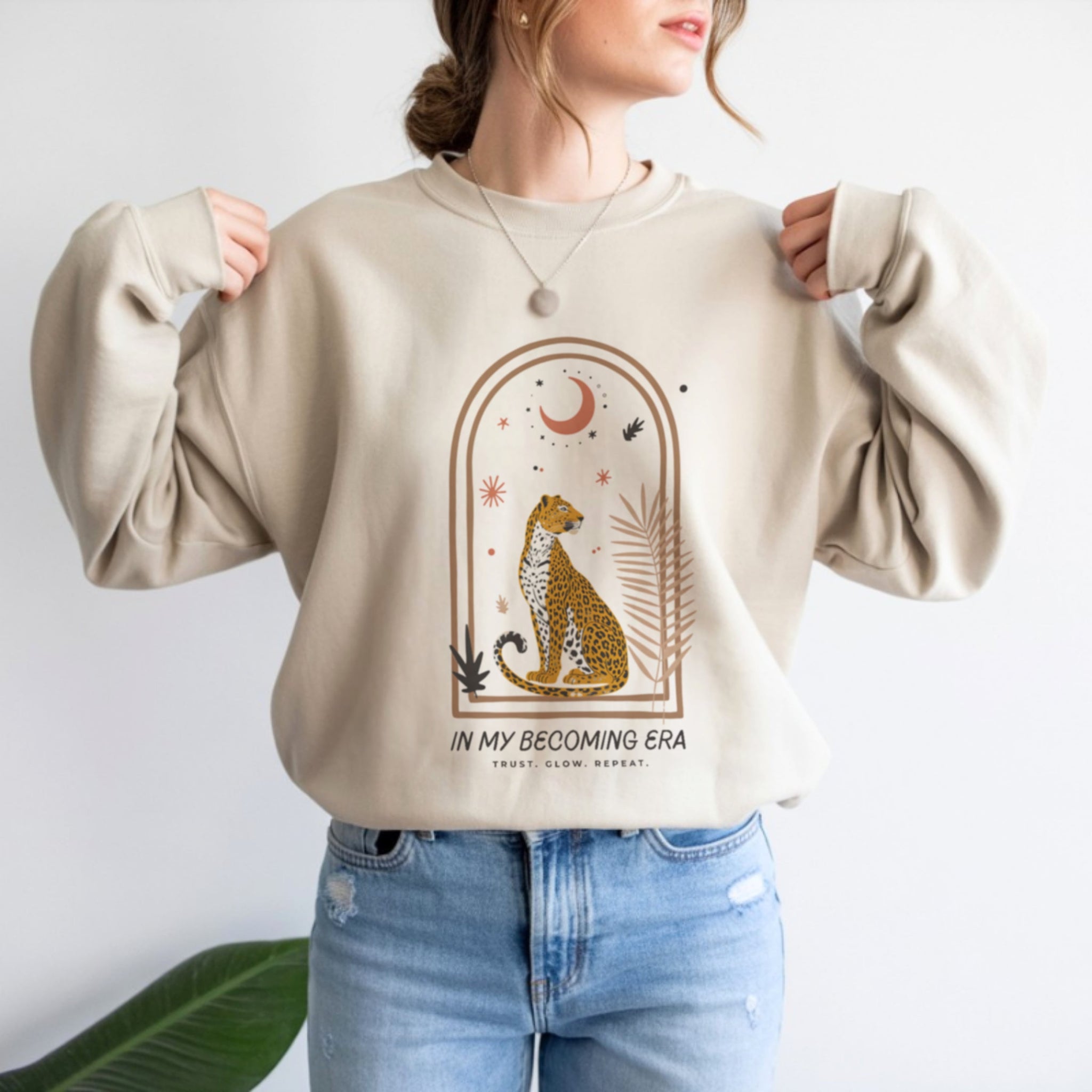 In My Becoming Era sweatshirt in white with boho cheetah arch design, women's spiritual crewneck apparel